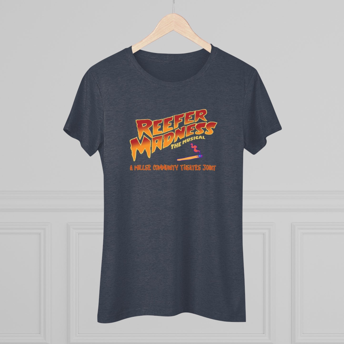 This limited-edition dark gray "Reefer Madness Cast Shirt - Miller Community Theatre - Women's Triblend Tee" by Printify features the text "Reefer Madness: The Musical" in bold, fiery letters across the chest. Below, in smaller orange text, it reads, "A Hill's Community Theatre Joint.