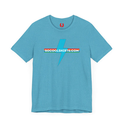 This unisex jersey short sleeve tee by Printify features a striking maroon color with a central light blue lightning bolt design. The text "SOCOOLSHIRTS.COM" is prominently displayed across the lightning bolt in white letters, set against a multicolored background that exudes retro vibes. The shirt is shown laid flat on a white backdrop.