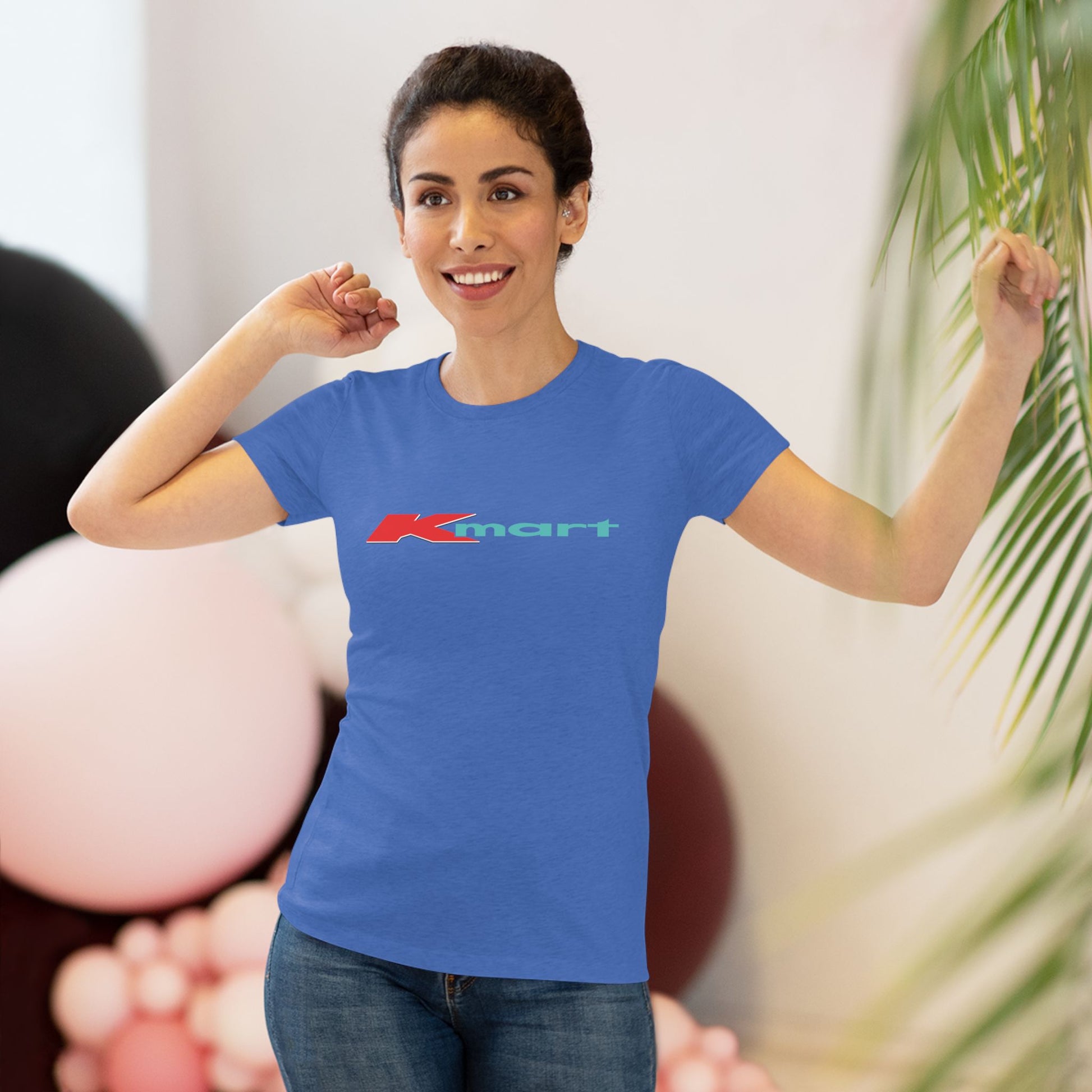 A women's triblend tee by Printify in light gray, featuring a casual and minimalist design that captures the essence of vintage style with a centered 1980s Retro Kmart logo on the front.