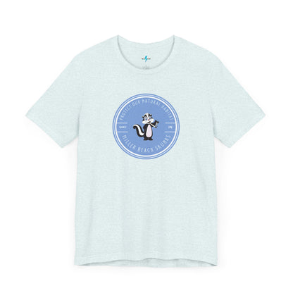 The Printify Miller Beach Skunks - Unisex Jersey Short Sleeve Tee is a gray T-shirt that features a circular blue logo at the center. Inside the logo, there is an illustration of a skunk with the text "Protect Our Habitat" and "Miller Beach Skunks" around the border, promoting environmental consciousness. The upper left part of the logo reads "Gary, IN.