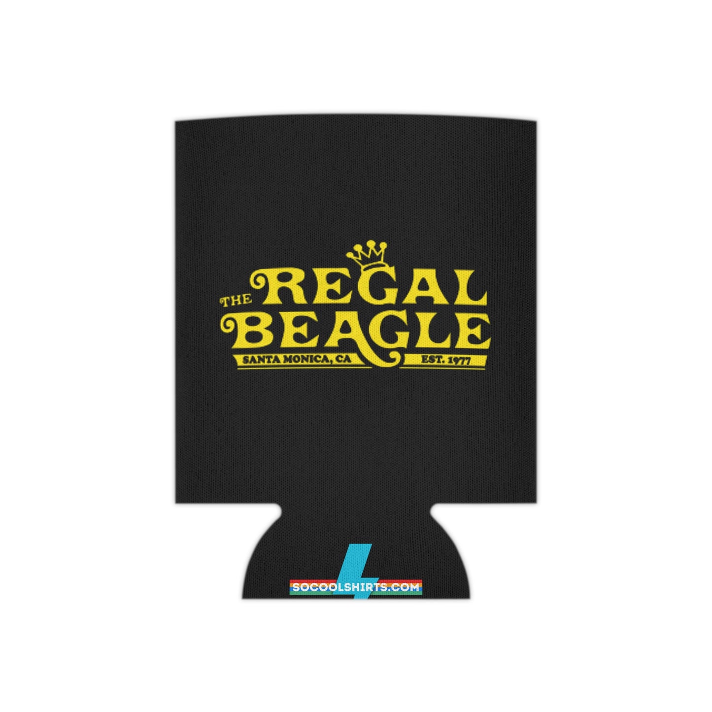 The Regal Beagle - Three's Company - Koozie by Printify features a black design with yellow text that reads "The Regal Beagle," alongside "Santa Monica, CA" and "Est. 1977." A small, partially visible URL in white and blue at the bottom reads socoolshirts.com. An ideal accessory for fans of Three’s Company!