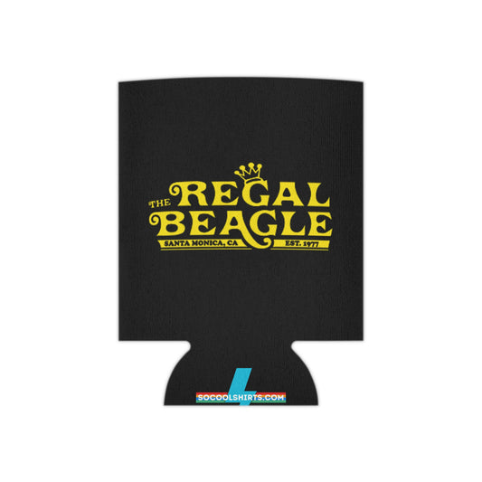 The Regal Beagle - Three's Company - Koozie by Printify features a black design with yellow text that reads "The Regal Beagle," alongside "Santa Monica, CA" and "Est. 1977." A small, partially visible URL in white and blue at the bottom reads socoolshirts.com. An ideal accessory for fans of Three’s Company!