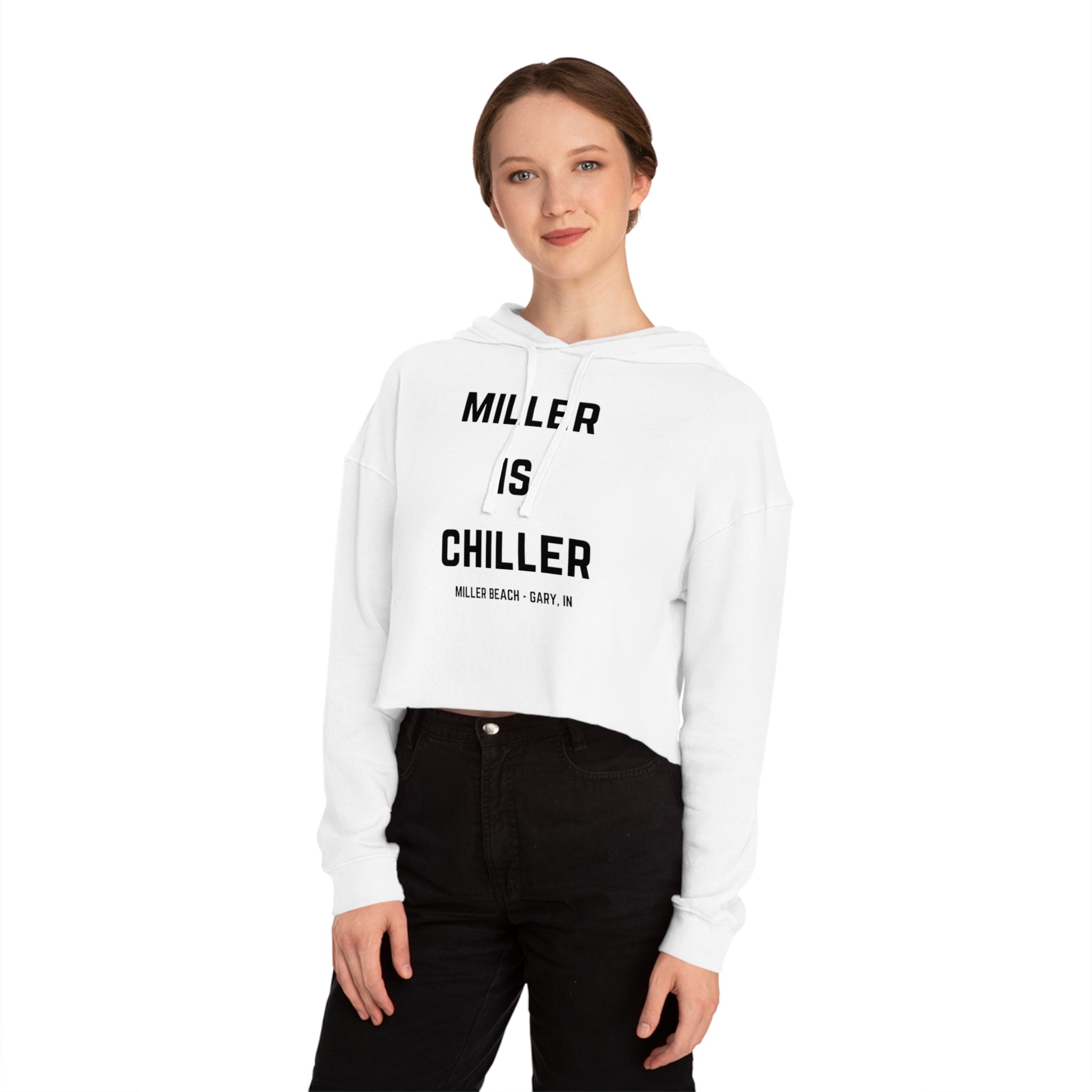 A white Women's Cropped Hooded Sweatshirt by Printify, featuring the phrase "MILLER IS CHILLER" printed in bold black letters on the front. Below the phrase, it says "MILLER BEACH • GARY, IN" in smaller black text. The SoCool Shirts hoodie includes a drawstring hood and long sleeves.