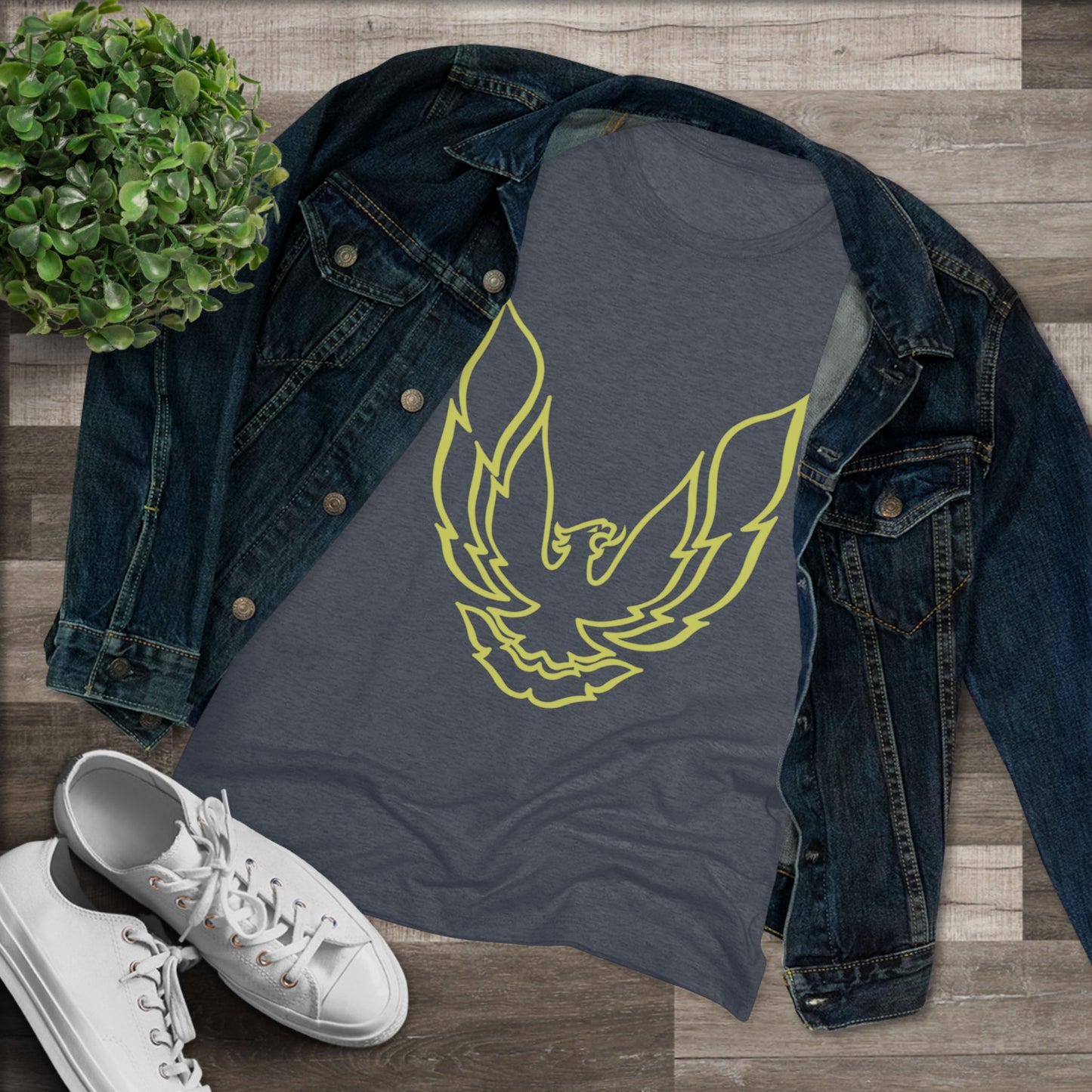 A retro 1970's-inspired red women's triblend tee by Printify, featuring a stylish gold phoenix design on the front. The vibrant, sleek graphic depicts the iconic Trans Am bird with its wings spread upward, giving this cozy t-shirt a bold and dynamic look.