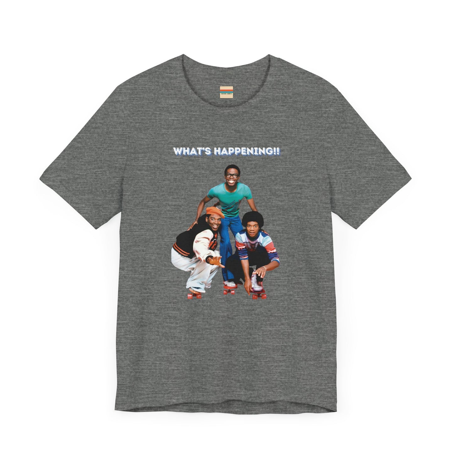 A "What's Happening!!" - Retro 1980s TV Show unisex jersey short sleeve tee by Printify, featuring a blue graphic with three smiling, energetically posing individuals dressed in fashionable casual attire. The top text "WHAT'S HAPPENING!!" is displayed in white, perfectly capturing the nostalgic vibe of the 1980s.