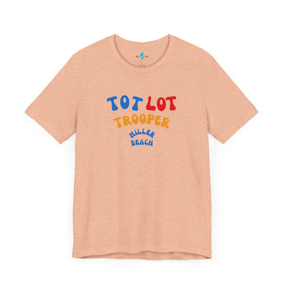 A green unisex jersey short sleeve tee from Printify, featuring colorful text on the front that reads "TOT LOT TROOPER MILLER BEACH" in blue, red, yellow, and orange letters. The shirt is displayed against a plain white background.