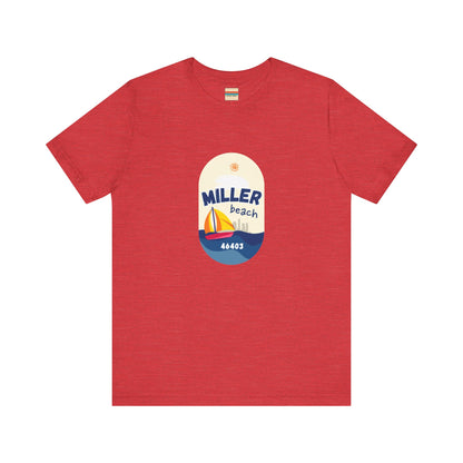 The Miller Beach Sailboat - Unisex Jersey Short Sleeve Tee by Printify features a vibrant graphic design portraying a sailboat on water with a sun above it and the text "MILLER beach 46403." This white retail fit shirt is crafted from soft Airlume combed cotton and showcases rounded graphics in blue, orange, and yellow.