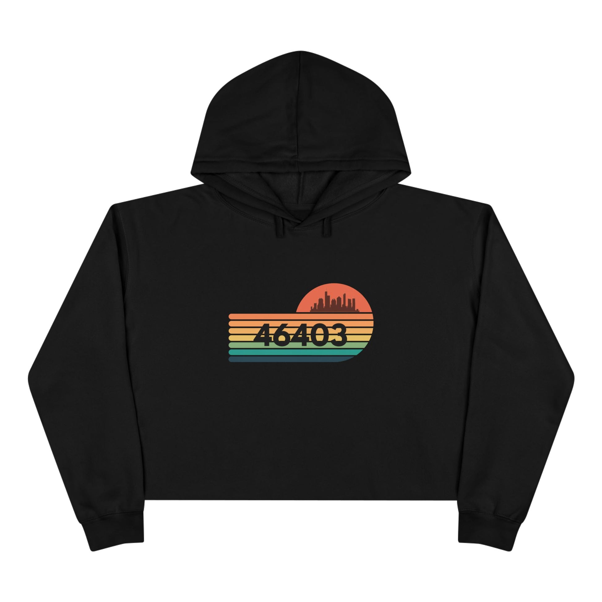 The Miller Beach 46403 Women's Crop Hoodie by Printify features a nostalgic design with a city skyline silhouette and the iconic "46403" zip code, set against a striped sunset backdrop in vibrant orange, green, and yellow hues that capture the essence of Miller Beach.