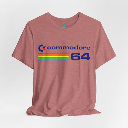 The 1980s Commodore 64 Computer C64 Unisex Jersey Short Sleeve Tee from Printify features a green T-shirt adorned with a vintage design showcasing the text "Commodore 64" and multicolored horizontal lines next to it. The word "Commodore" is emblazoned in blue alongside the Commodore logo, while the number "64" is also highlighted in blue on the right. Ideal for any retro tech enthusiast, this shirt is displayed against a white background.