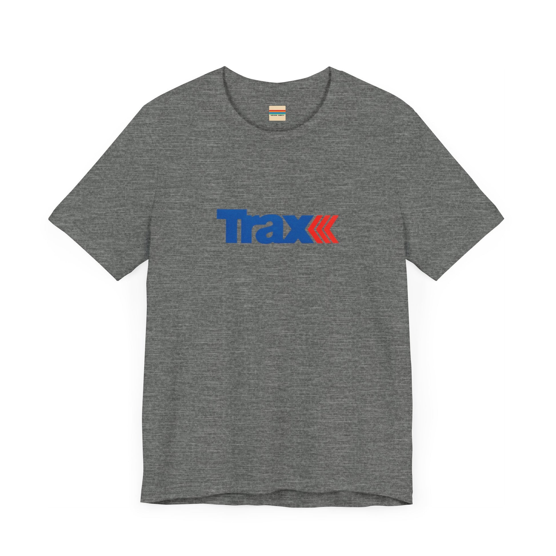 A gray unisex jersey short sleeve tee from Printify, inspired by retro 1980s Kmart style. The "Trax" logo is printed in blue letters, followed by three red arrows pointing to the right. This classic Trax Brand T-shirt is laid flat against a white background, capturing nostalgic fashion vibes.