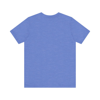 A gray unisex jersey short sleeve tee from Printify, inspired by retro 1980s Kmart style. The "Trax" logo is printed in blue letters, followed by three red arrows pointing to the right. This classic Trax Brand T-shirt is laid flat against a white background, capturing nostalgic fashion vibes.