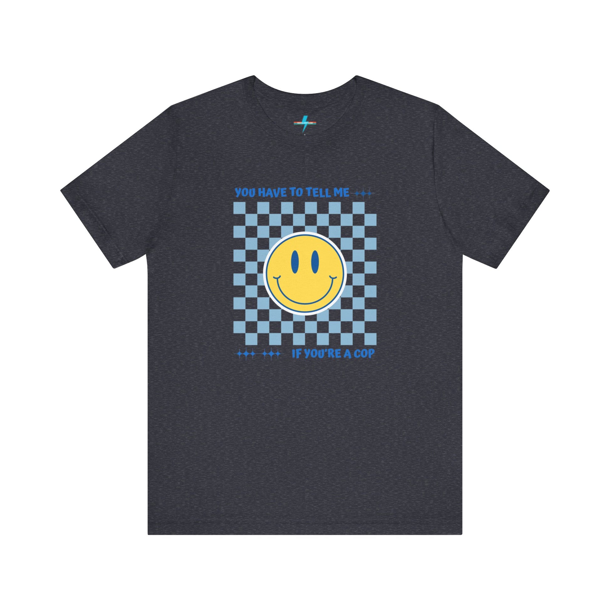 A light yellow unisex jersey short sleeve tee from Printify featuring a blue and yellow checkerboard pattern with a large yellow smiley face in the center. The shirt displays blue text above and below the pattern that reads, "You have to tell me if you're a cop." It's made from 100% Airlume combed and ring-spun cotton.