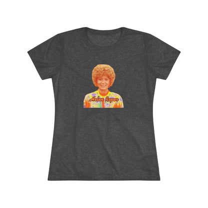 A Women's Triblend Tee by Printify, titled "Helen Roper - Three's Company," features a red design with an illustration of a smiling person with curly hair and colorful clothing. Below the illustration, the text "Helen Roper" is written in a bold, retro font, capturing the essence of vintage TV humor.