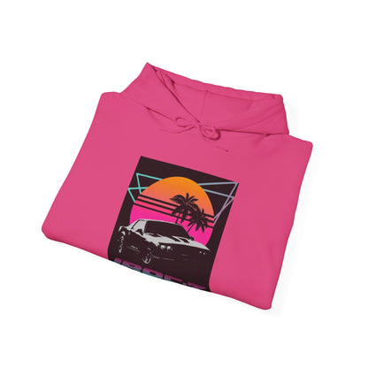 Introducing the Chevrolet IRoc Z28 - 1980s Retro Hoodie by Printify: This vibrant pink hoodie showcases a striking retro design on the front, featuring a classic American muscle car set against an orange and red sunset with palm trees, intersected by geometric shapes. The text "IROCZ" is prominently displayed below the image. Offering a relaxed fit and equipped with a front pocket, this hoodie perfectly captures the essence of 1980s style.