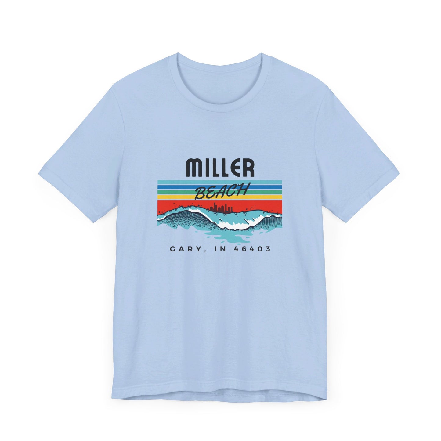 The Miller Beach 46403 Surf Style - Unisex Jersey Short Sleeve Tee by Printify features a retro surf-inspired design on a yellow background. The shirt displays "MILLER BEACH" above waves with a skyline illustration, while "Cary, IN 46403" is printed below the waves. The vibrant design also includes colorful stripes in shades of blue, red, and orange.