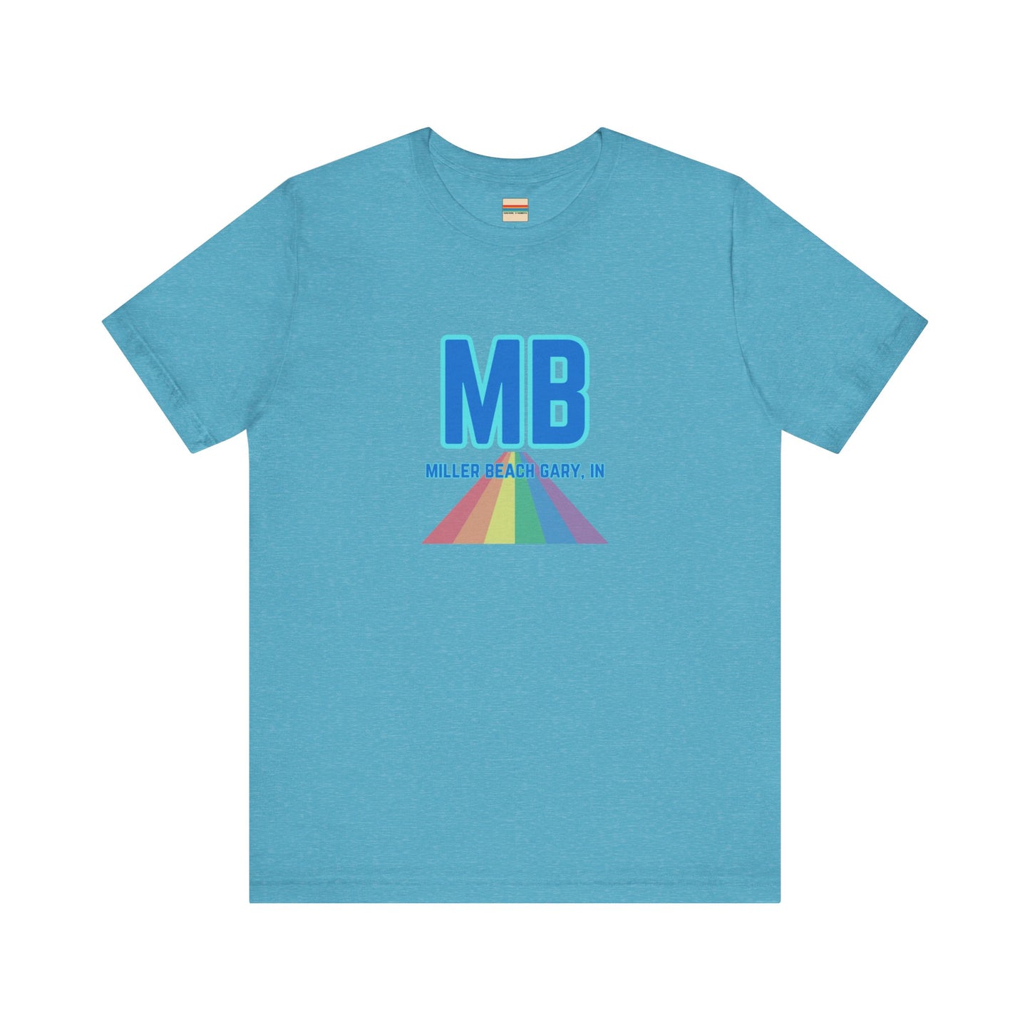 The Miller Beach Pride - Unisex Jersey Short Sleeve Tee by Printify is a white shirt made from 100% Airlume combed cotton. It showcases a design with large, bold blue letters "MB" at the top. Beneath it, the text "MILLER BEACH GARY, IN" is written in blue. A colorful, triangular rainbow graphic extends downward from the text, symbolizing Miller Beach pride.