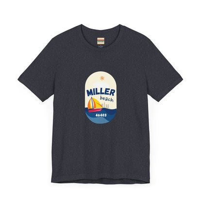 The Miller Beach Sailboat - Unisex Jersey Short Sleeve Tee by Printify features a vibrant graphic design portraying a sailboat on water with a sun above it and the text "MILLER beach 46403." This white retail fit shirt is crafted from soft Airlume combed cotton and showcases rounded graphics in blue, orange, and yellow.