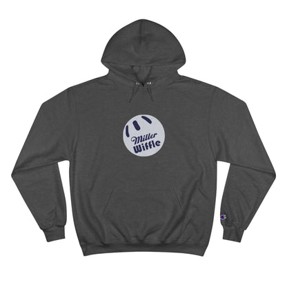 A navy blue Printify Miller Beach Wiffle Ball OG Logo - Sweatshirt, featuring a white wiffle ball graphic on the chest with "Miller Wiffle" in blue beneath it. Made from recycled polyester, this hoodie includes a front pocket, drawstrings, and the Champion logo on the left sleeve. It also offers Double Dry® technology for added comfort.