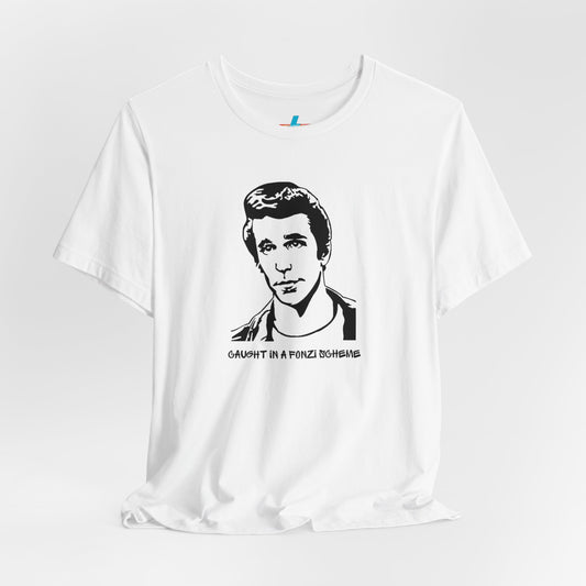 A white unisex jersey short sleeve tee by Printify, named "Caught in a Fonzi Scheme - Happy Days - Retro," features a black and white illustration of a person with a serious expression and styled hair, perfectly capturing the nostalgic apparel vibe. Below the illustration, the text reads "CAUGHT IN A FONZI SCHEME," making it an ideal Happy Days tribute shirt.