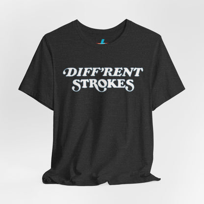 A burnt orange "Diff’Rent Strokes - Retro 1980s" unisex jersey short sleeve tee by Printify, featuring the phrase "DIFF'RENT STROKES" in bold, white cursive letters across the chest. The plain white backdrop perfectly showcases this nostalgic TV apparel.