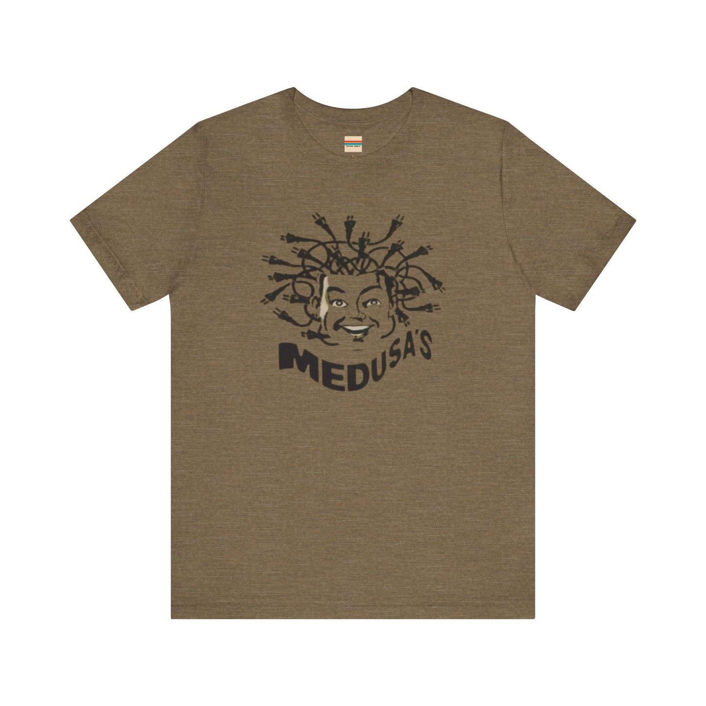 A cream-colored unisex jersey short sleeve tee from Printify, titled "Medusa's 1980s Dance Club Chicago," features a black and white illustration of a cartoonish Medusa head. The soft cotton design showcases numerous snakes as hair with a smiling face. Below, the word "MEDUSA'S" is printed in bold, playful font.