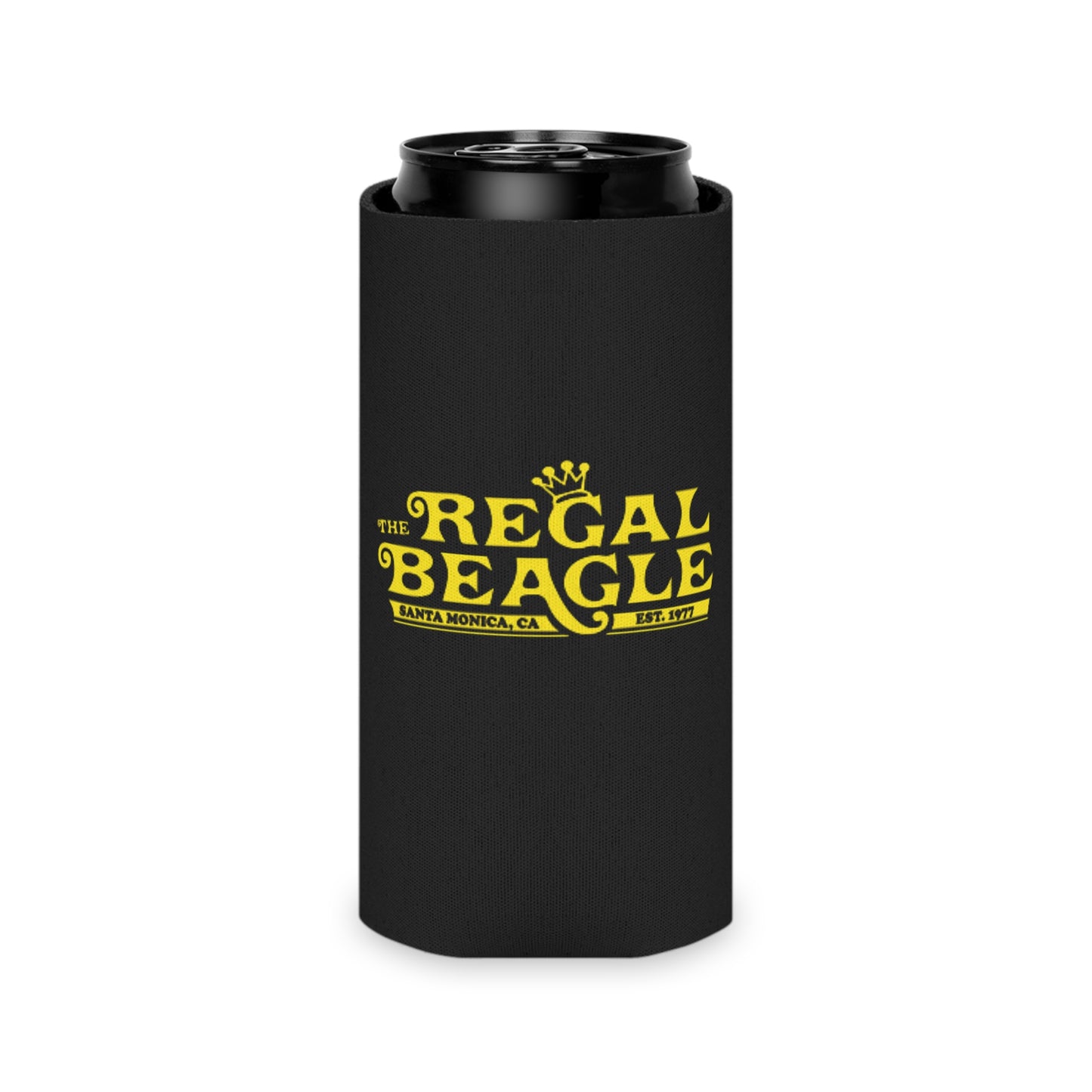 The Regal Beagle - Three's Company - Koozie by Printify features a black design with yellow text that reads "The Regal Beagle," alongside "Santa Monica, CA" and "Est. 1977." A small, partially visible URL in white and blue at the bottom reads socoolshirts.com. An ideal accessory for fans of Three’s Company!